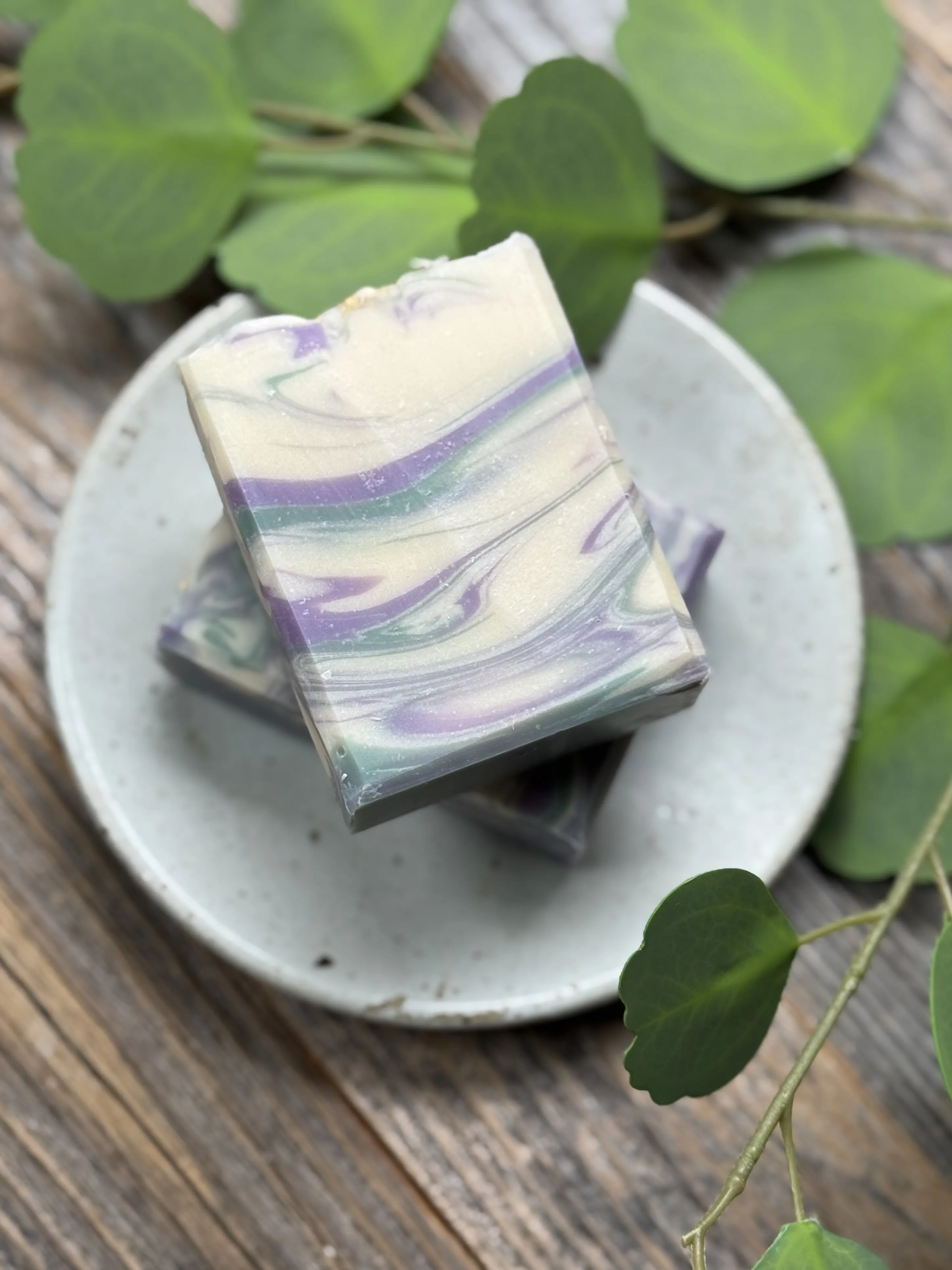 Image of bar soap with white, green & purple swirls